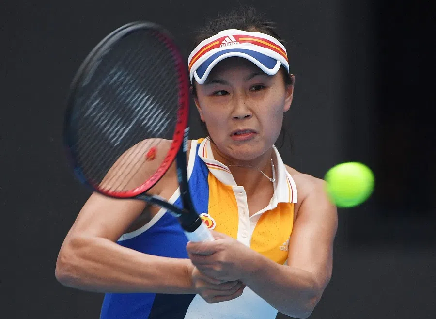 In this file photograph taken on 4 October 2017, China’s Peng Shuai hits a return during her women’s singles at the China Open tennis tournament in Beijing. In 2021, Peng disappeared from the public eye and was erased from Chinese internet and social media sites after she accused one of China’s leaders of rape on her Weibo account, prompting concerns about her well-being. (Greg Baker/AFP)