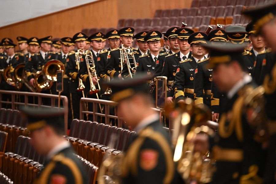 Members of the Police Liberation Army's band arrive ahead of the closing ceremony of the 14th National People's Congress (NPC) at the Great Hall of the People in Beijing, China, on 11 March 2024. (Jade Gao/AFP)