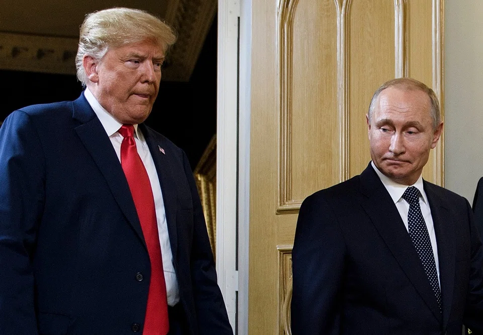 US President Donald Trump (left) and Russian President Vladimir Putin arrive for a meeting in Helsinki, on 16 July 2018. (Brendan Smialowski/AFP)