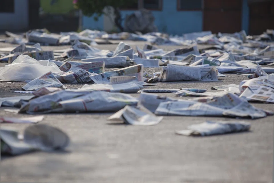 Old newspapers scattered on the street. (Shutterstock)