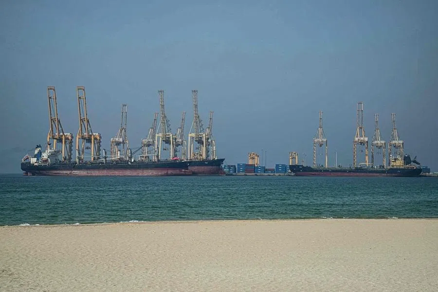 Tankers are seen at the Khor Fakkan Container Terminal, the only natural deep-sea port in the region and one of the major container ports in the Sharjah Emirate, along the Strait of Hormuz, a waterway through which one-fifth of global oil output passes on 23 June 2025. (Giuseppe Cacace/AFP)