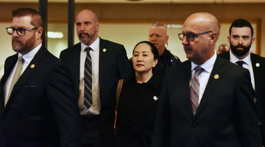 Huawei CFO Meng Wanzhou leaves British Columbia Supreme Court with her security detail on January 23, 2020 in Vancouver, British Columbia. Supreme Court judge adjourned proceedings over whether or not to send Meng to the US to face fraud charges, effectively leaving Meng in limbo, as no date was set for a decision.