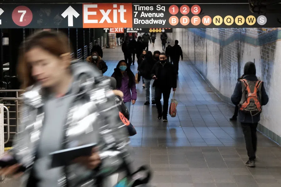 People walk through a subway station in Manhattan on 19 January 2022 in New York City, US. (Spencer Platt/Getty Images/AFP)