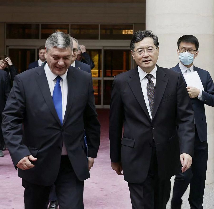 This handout picture taken and released by the Ministry of Foreign Affairs of the People's Republic of China on 25 June 2023 shows Russia's deputy foreign minister Andrei Rudenko (left) and China's Foreign Minister Qin Gang walking together as they meet in Beijing, China. (Handout/Ministry of Foreign Affairs of the People's Republic of China/AFP)