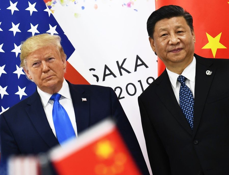 US President Donald Trump and Chinese President Xi Jinping at their bilateral meeting on the sidelines of the G20 Summit in Osaka, Japan. President Trump on 11 October 2019 announced that the US and China had reached an initial deal in the drawn-out trade war. (Brendan Smialowski/AFP)