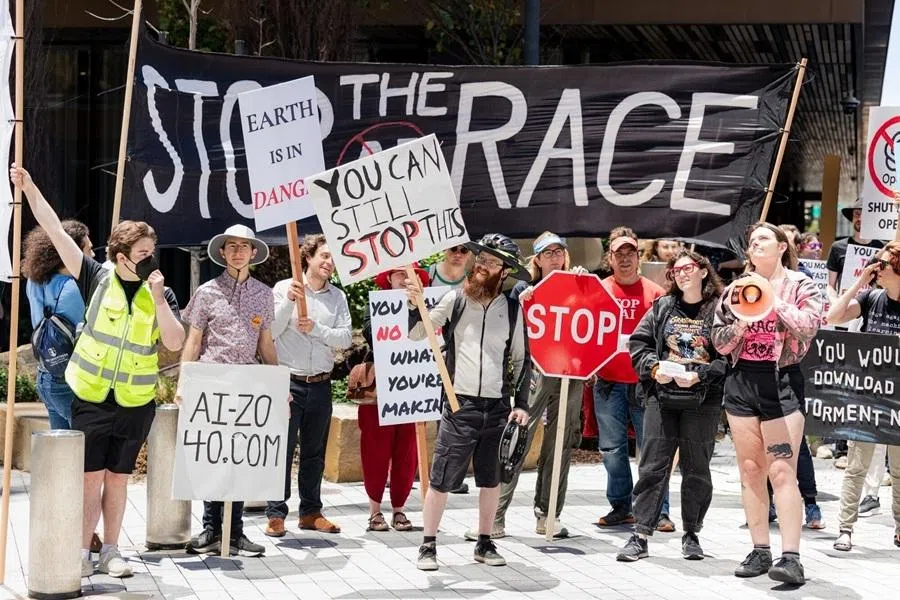 Demonstrators hold signs during a protest against artificial intelligence (AI) outside Open AI headquarters offices in San Francisco, California, US, on 11 July 2026.