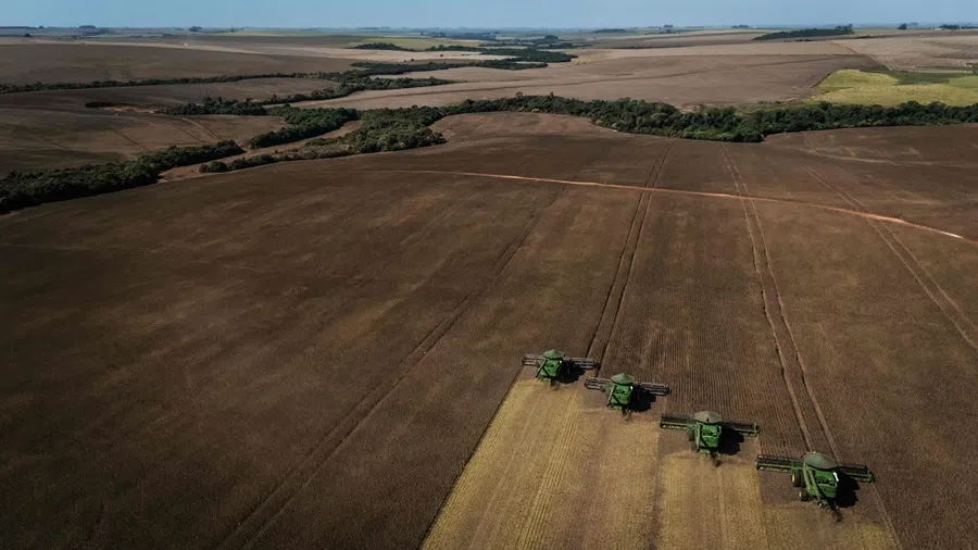Aerial view of harvest machines working in a soybean field in Cruz Alta, Rio Grande do Sul state, Brazil, on 2 April 2026.
