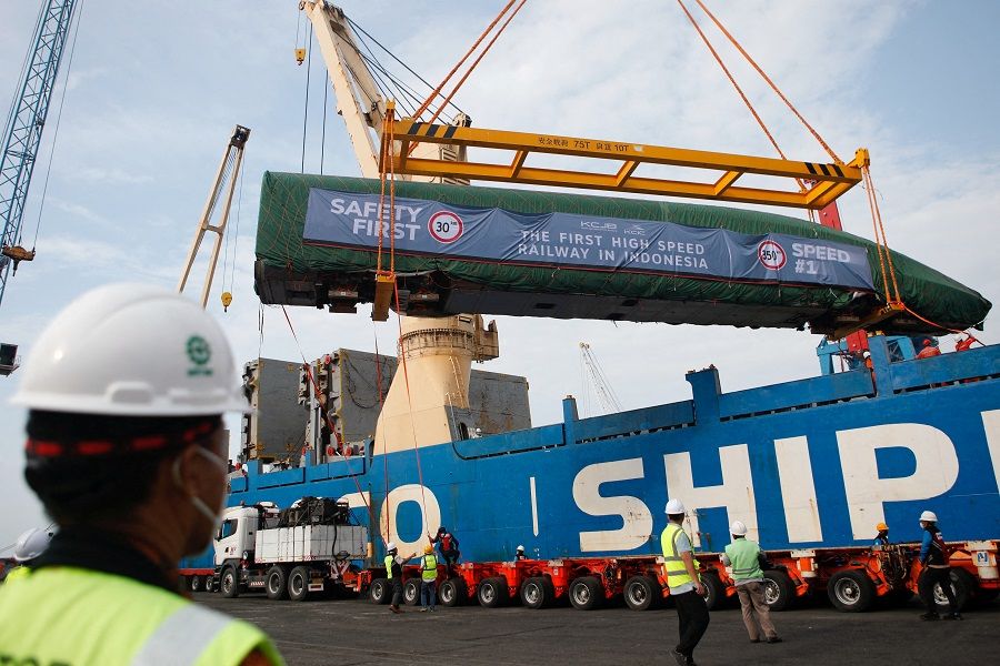 An Electric Multiple Unit high-speed train for a rail link project, which is part of China's Belt and Road Initiative, arrives at Tanjung Priok port during load in Jakarta, Indonesia, on 2 September 2022. (Ajeng Dinar Ulfiana/Reuters)