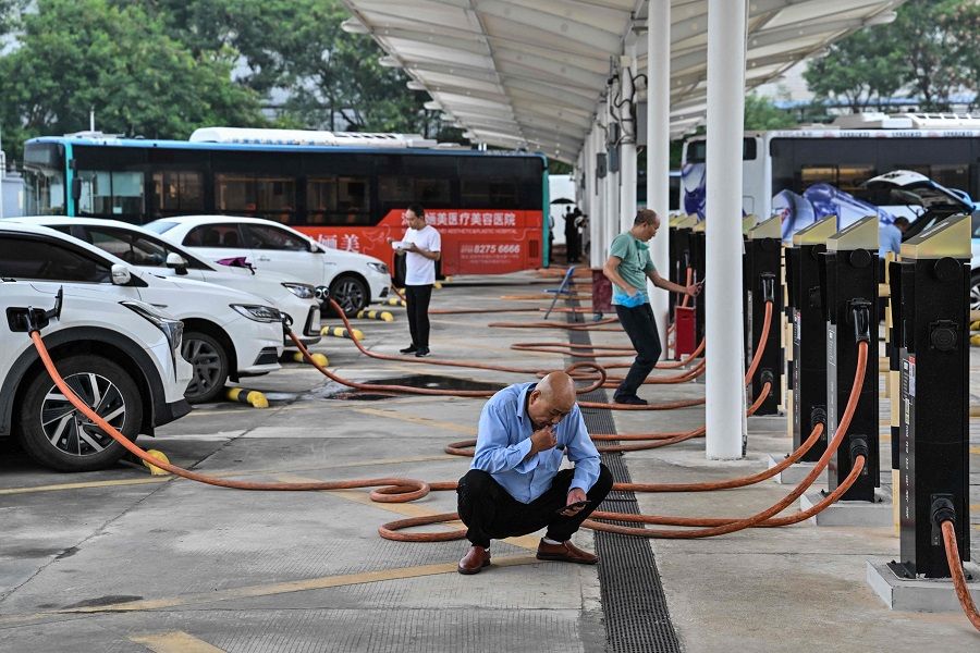 In this picture taken on 18 October 2023, drivers wait for their electric vehicles to charge at Antuoshan charging station in Shenzhen, Guangdong province, China. (Hector Retamal/AFP)