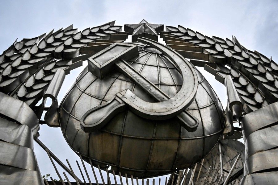 This photo taken on 31 August 2022 shows an emblem of the USSR, which was removed from Leninsky Avenue after the collapse of the Soviet Union in 1991, displayed at the Modern History Sculpture Museon park in Moscow. (Alexander Nemenov/AFP)