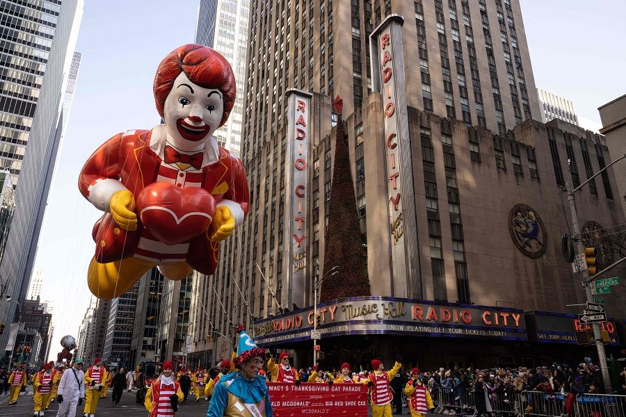 The Ronald McDonald balloon floats past Radio City Music Hall during the 96th Annual Macy's Thanksgiving Day Parade in New York City, US, on 24 November 2022. (Yuki Iwamura/AFP)
