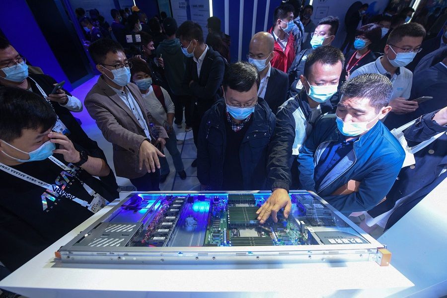 Visitors look at Alibaba's new servers "Panjiu" at the Apsara Conference, a cloud computing and artificial intelligence (AI) conference, in Hangzhou, Zhejiang province, China, on 19 October 2021. (STR/AFP)