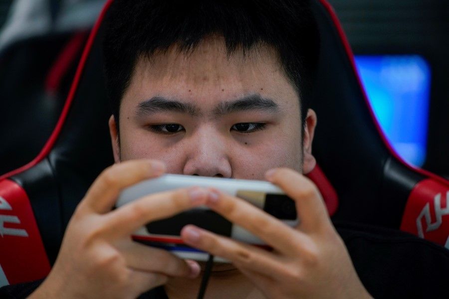 An esports team member trains at his club in Shanghai, China, on 3 September 2021. (Aly Song/Reuters)