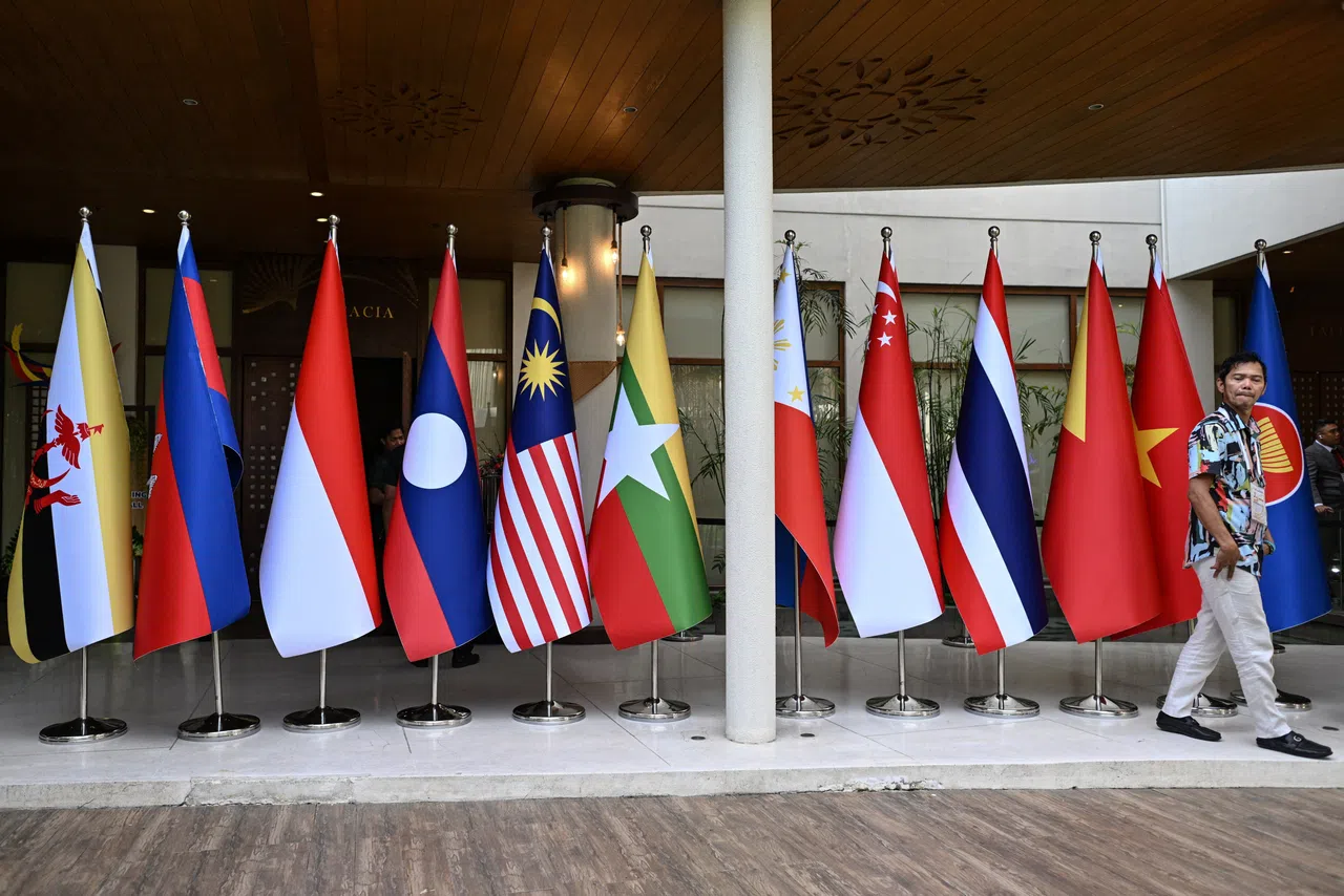 A man walks past flags of the Association of Southeast Asian Nations (ASEAN) at the International Media Center during the 59th ASEAN Foreign Ministers' Meeting and Related Meetings in Pasay, Metro Manila, Philippines, 20 July 2026.