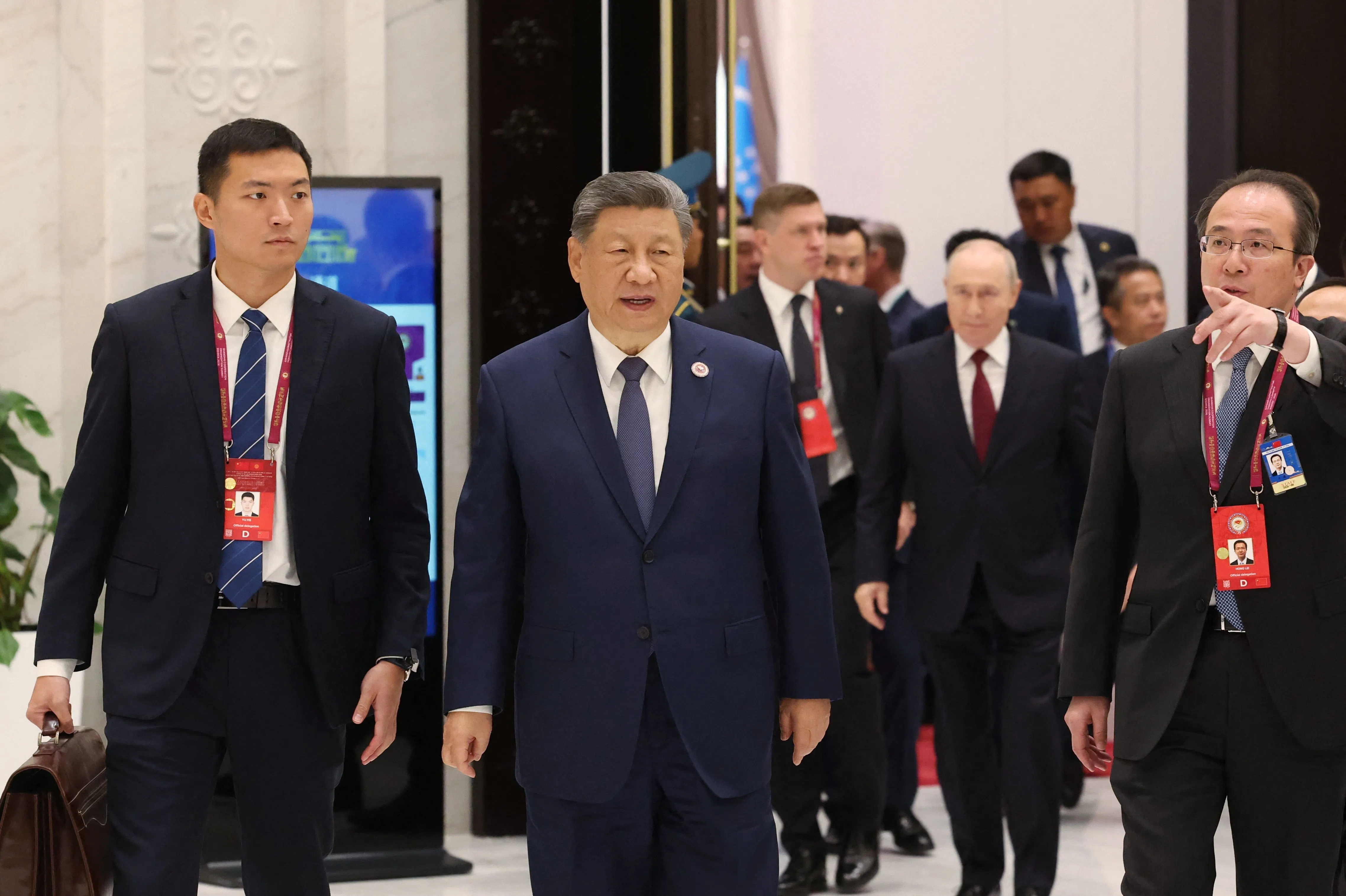 In this pool photograph distributed by the Russian state agency Sputnik, China's President Xi Jinping walks during the Shanghai Cooperation Organisation (SCO) summit in Bishkek on 1 September 2026.
