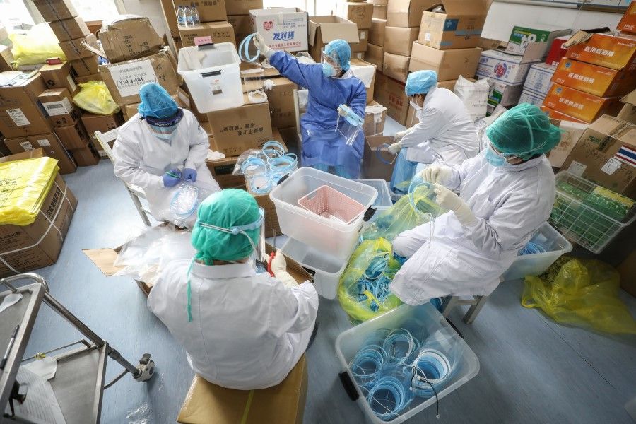Medical staff assembling protective masks at the Red Cross hospital in Wuhan. (AFP)