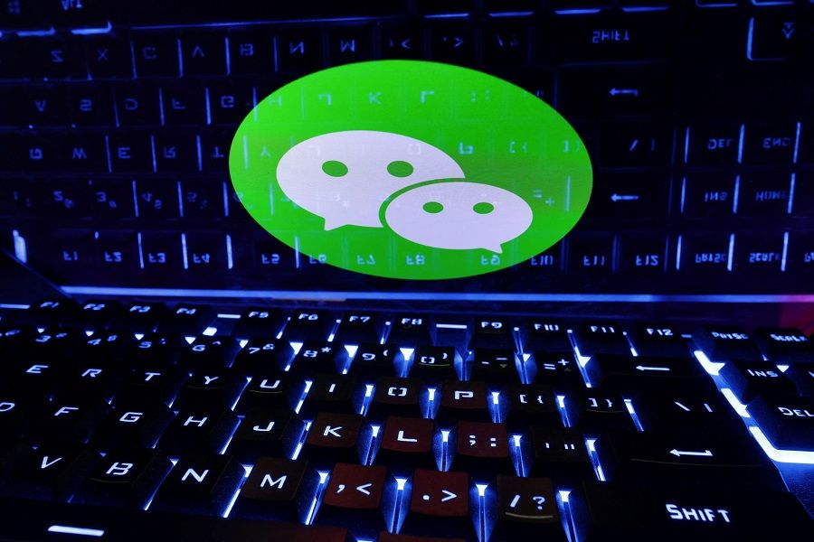 A keyboard is placed in front of a displayed WeChat logo in this illustration taken 21 February 2023. (Dado Ruvic/Illustration/Reuters)