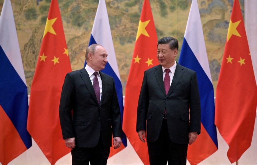 Russian President Vladimir Putin attends a meeting with Chinese President Xi Jinping in Beijing, China, 4 February 2022. (Sputnik/Aleksey Druzhinin/Kremlin via Reuters)
