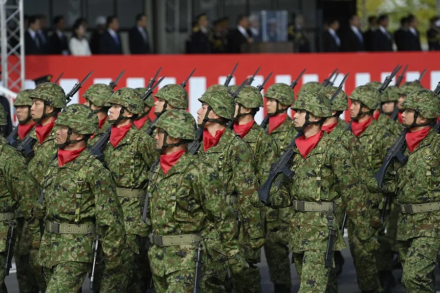 Members of the Japan Self Defense Forces (JSDF) march in formation at Ground Self-Defence Force Camp Asaka on 9 November 2024, as Japanese Prime Minister Shigeru Ishiba (not seen) reviews the troops for its 70th anniversary. (David Mareuil/Pool/AFP)