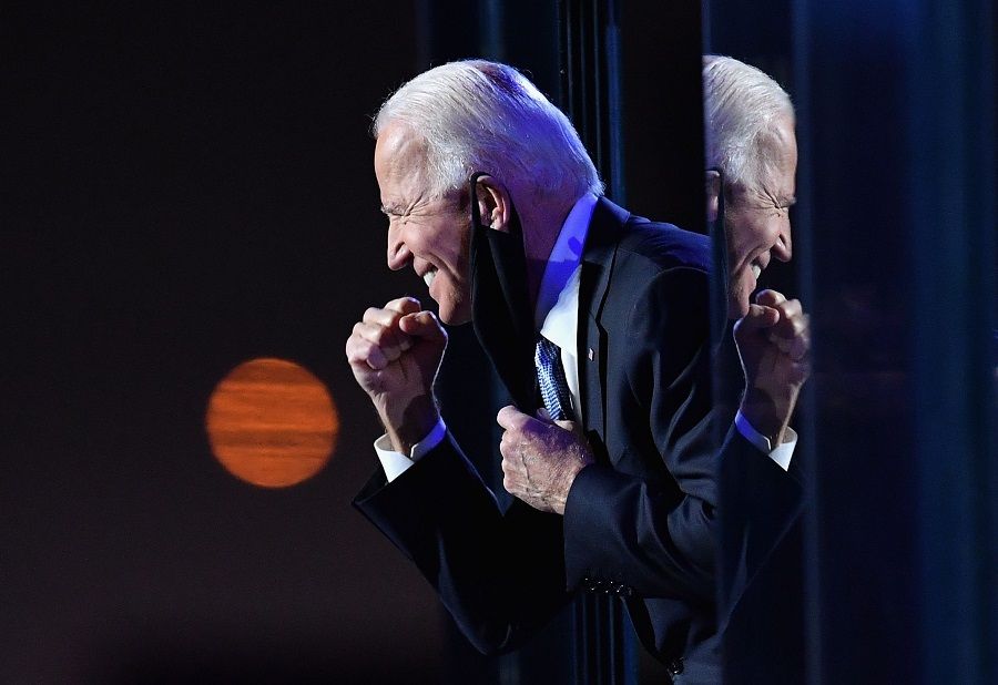 US President-elect Joe Biden gestures to the crowd after he delivered remarks in Wilmington, Delaware, on 7 November 2020. (Angela Weiss/AFP)
