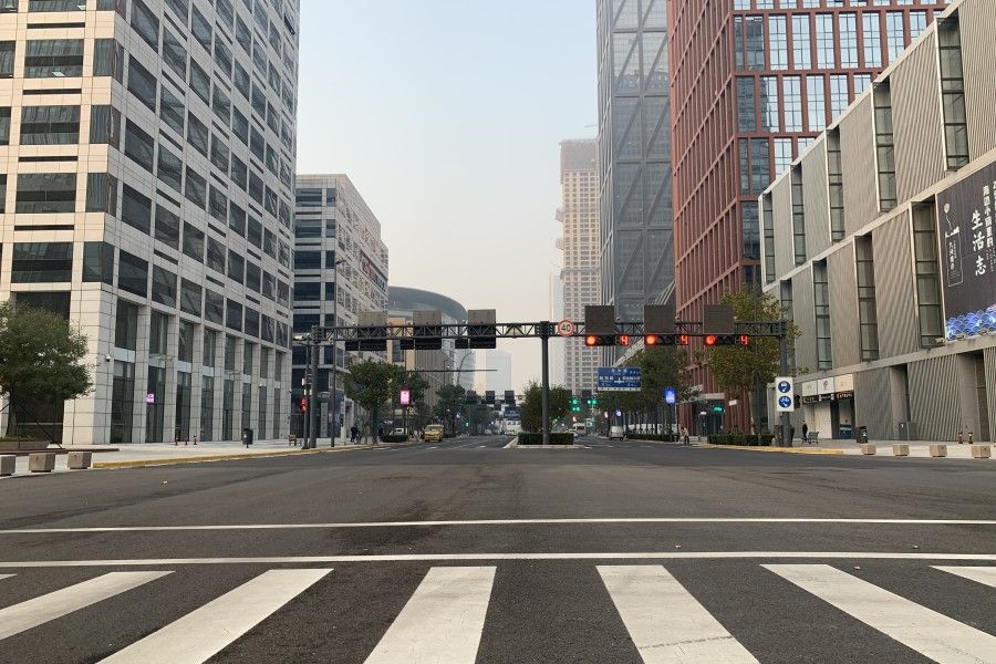 A main street in the business district of Yujiapu is all but deserted on a weekday afternoon.