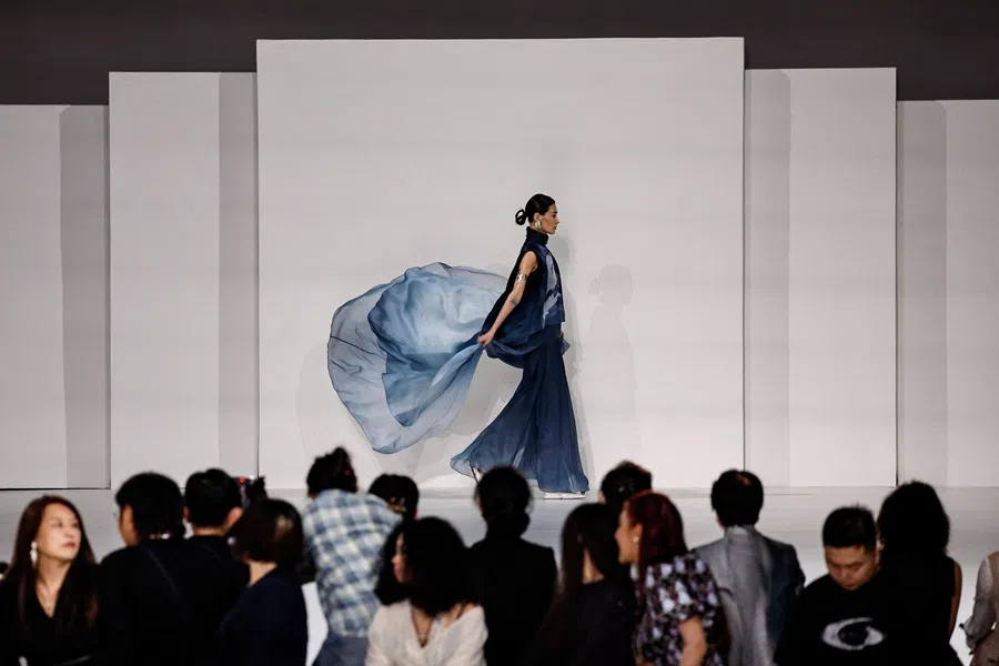 A model presents a creation for the MISUITY Spring/Summer 2026 collection show by designer Gao Tian, during China Fashion Week in Beijing, China, 5 September 2025. (Tingshu Wang/Reuters)
