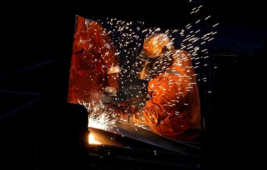 Workers work at the British Steel site in Scunthorpe, the UK, on 17 April 2025.