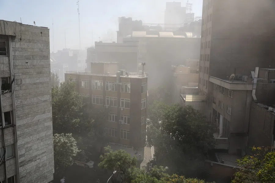 Smoke rises from an explosion following the Israeli strikes on Iran, in Tehran, Iran, on 15 June 2025.