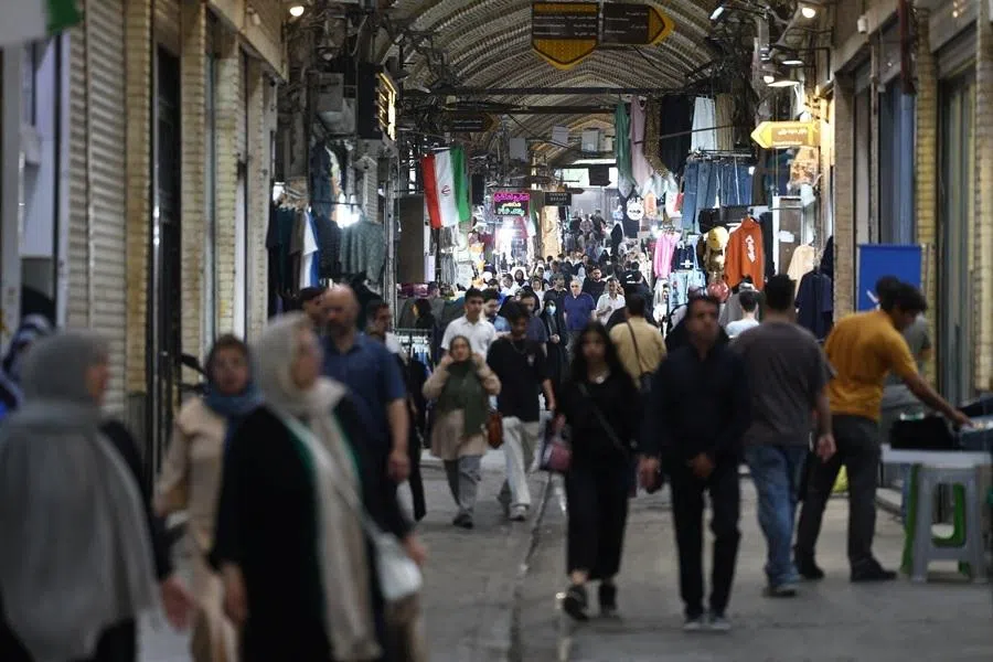 People walk in Tehran Bazaar, in Tehran, Iran, 16 May 2026.