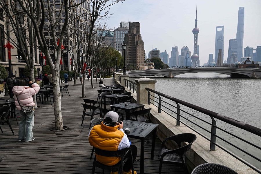People visit the Hongkou district next to Suzhou River in Shanghai, China, on 6 March 2024. (Hector Retamal/AFP)
