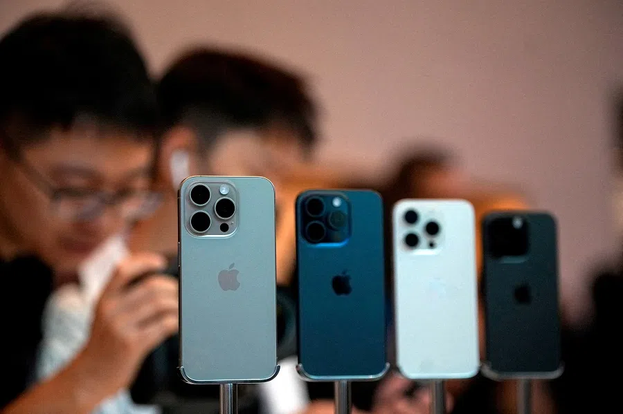People look at the new iPhone 15 Pro as Apple’s new iPhone 15 officially goes on sale across China at an Apple store in Shanghai, China, on 22 September 2023. (Aly Song/Reuters)
