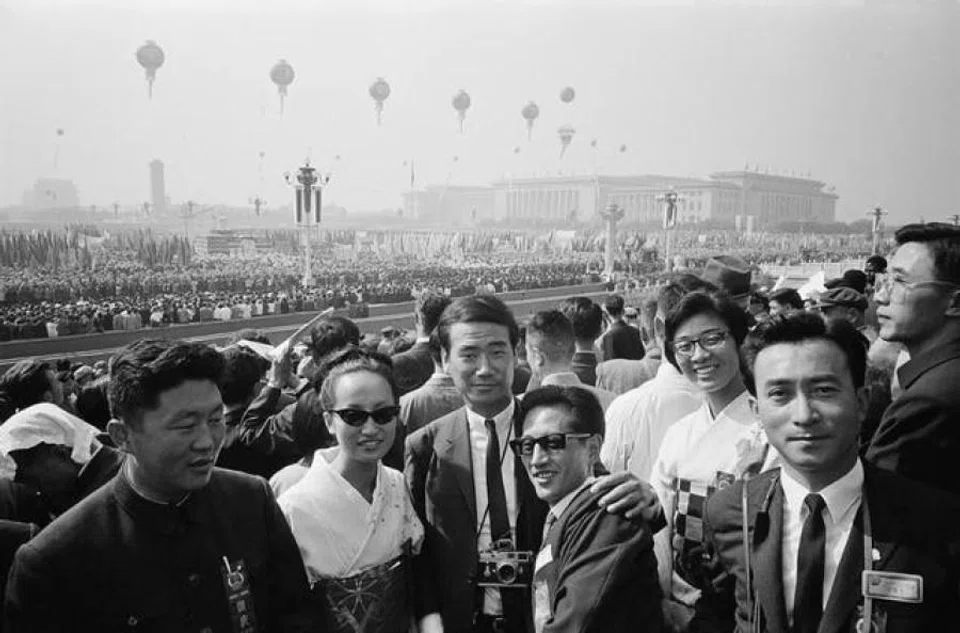 Koichi Saito (third from left), as part of a Japanese youth delegation, attends the May Day celebration at Tiananmen Square, Beijing, 1965.