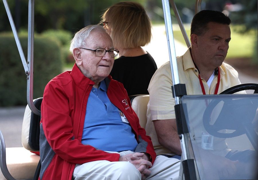 Chairman and CEO of Berkshire Hathaway Warren Buffett rides in a golf cart at the Allen & Company Sun Valley Conference on 7 July 2021 in Sun Valley, Idaho, US. (Kevin Dietsch/Getty Images/AFP)