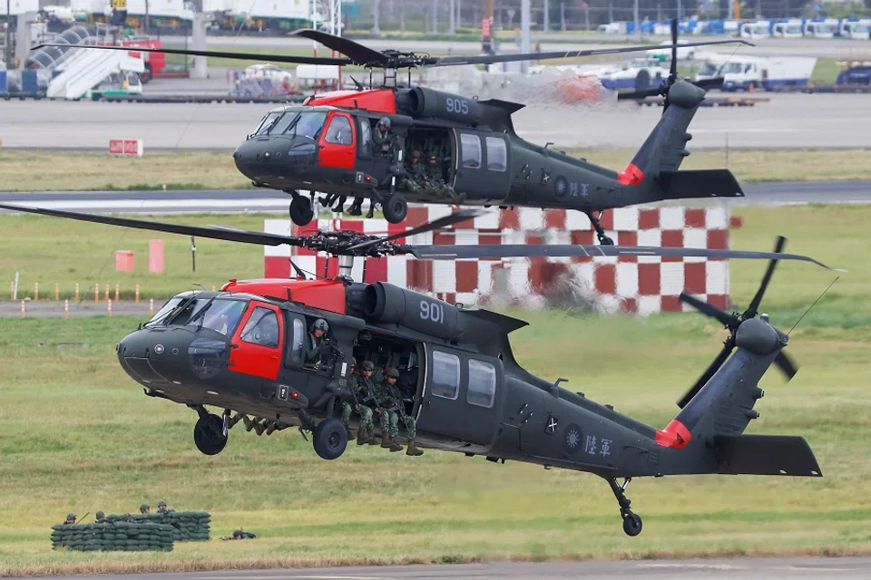 Black Hawk helicopters prepare to land at Taoyuan International Airport as part of the annual Han Kuang military exercise in Taoyuan, Taiwan, 26 July 2023. (Ann Wang/Reuters)