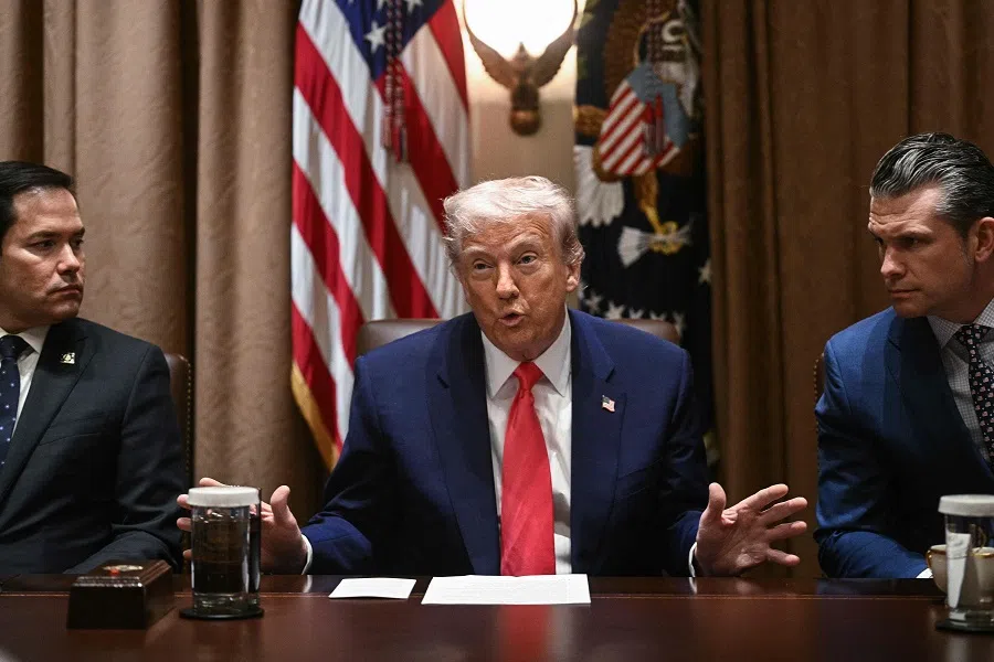 US President Donald Trump, alongside Secretary of State Marco Rubio (L) and Secretary of Defense Pete Hegseth (R), speaks during a cabinet meeting in the Cabinet Room of the White House on 10 April 2025, in Washington, DC. (Brendan Smialowski/AFP)