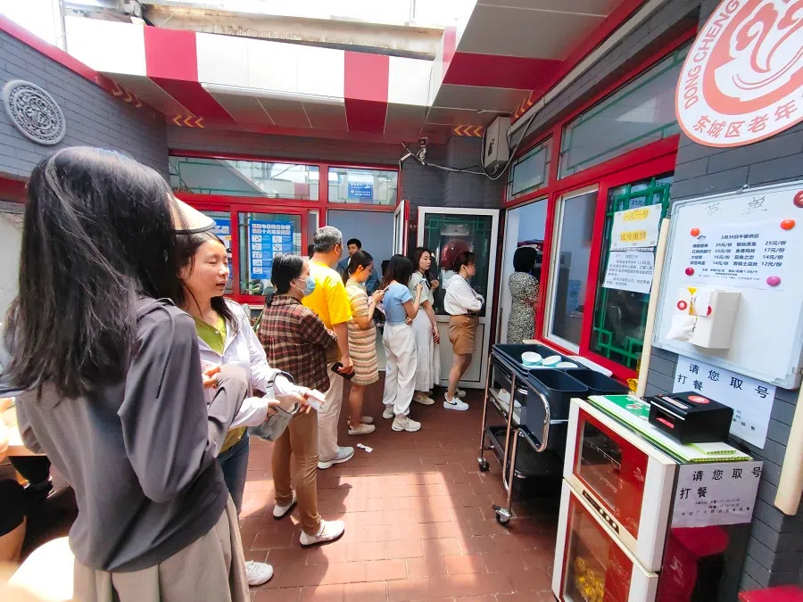Snaking queues outside a community canteen in Beijing.