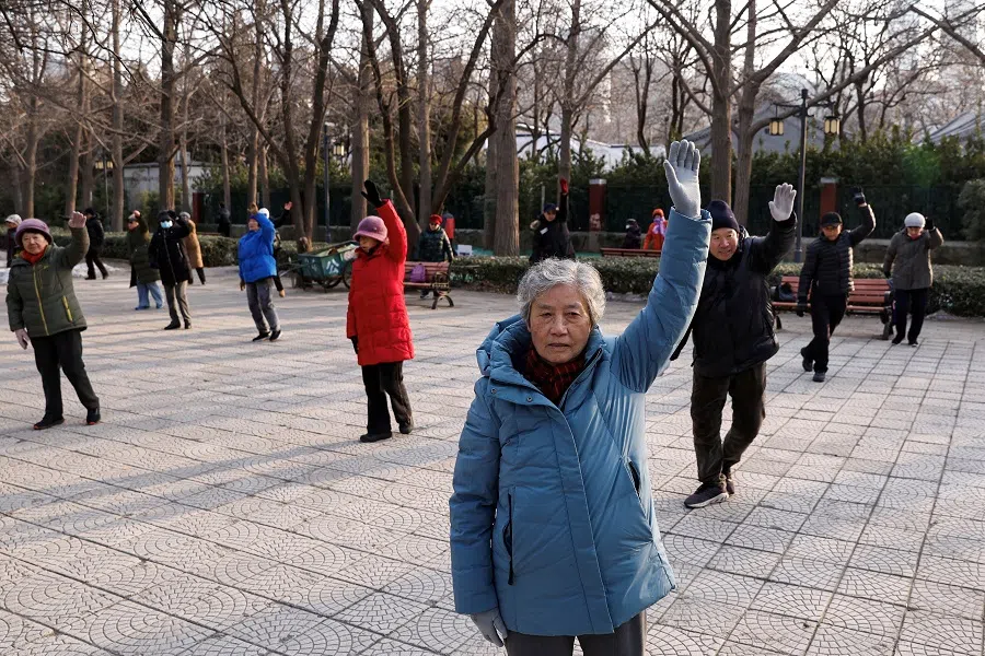 Elderly people dance at a park in Beijing, China, 16 January 2024. (Tingshu Wang/Reuters)