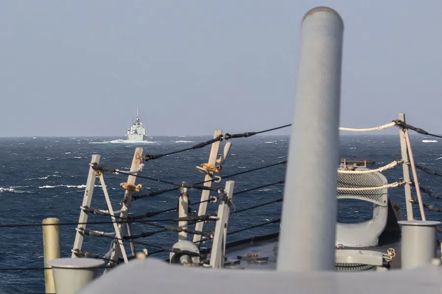 In this handout photo courtesy of the US Navy taken on 20 September 2022, the Royal Canadian Navy Halifax-class frigate HMCS Vancouver (FFH 331) (left) transits the Taiwan Strait with guided-missile destroyer USS Higgins (DDG 76) while conducting a routine transit. (US Navy/AFP)