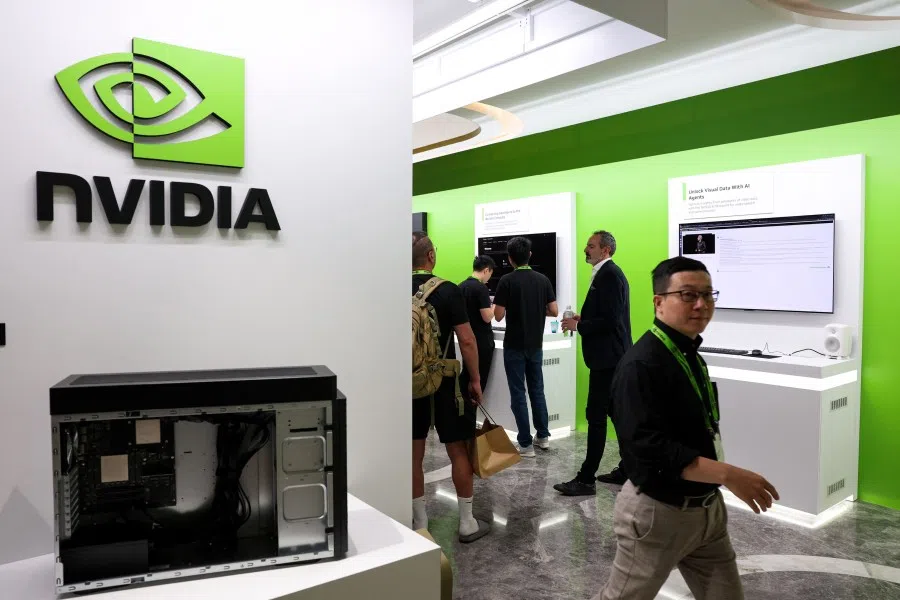 People attend a Nvidia production preview exhibition in Taipei on 21 May 2025. Chinese authorities summoned US technology giant Nvidia on 31 July 2025 to discuss “serious security issues” discovered involving its chips, the country’s top internet regulator said. (I-Hwa Cheng/AFP)