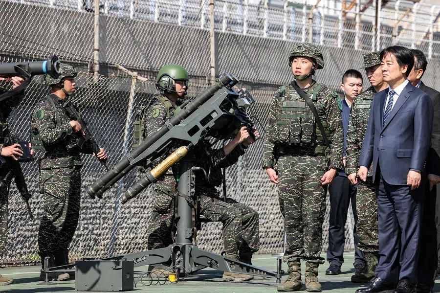 Taiwan’s President Lai Ching-te (R) watches soldiers demonstrating the FIM-92 Stinger man-portable air-defence system during an inspection of the troops taking part in the Rapid Response Exercise while visiting the Songshan military airbase in Taipei on 21 March 2025. (I-Hwa Cheng/AFP)