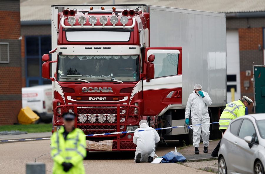 Police are seen at the scene where bodies were discovered in a lorry container, in Grays, Essex, Britain on October 23, 2019. (REUTERS/Peter Nicholls)