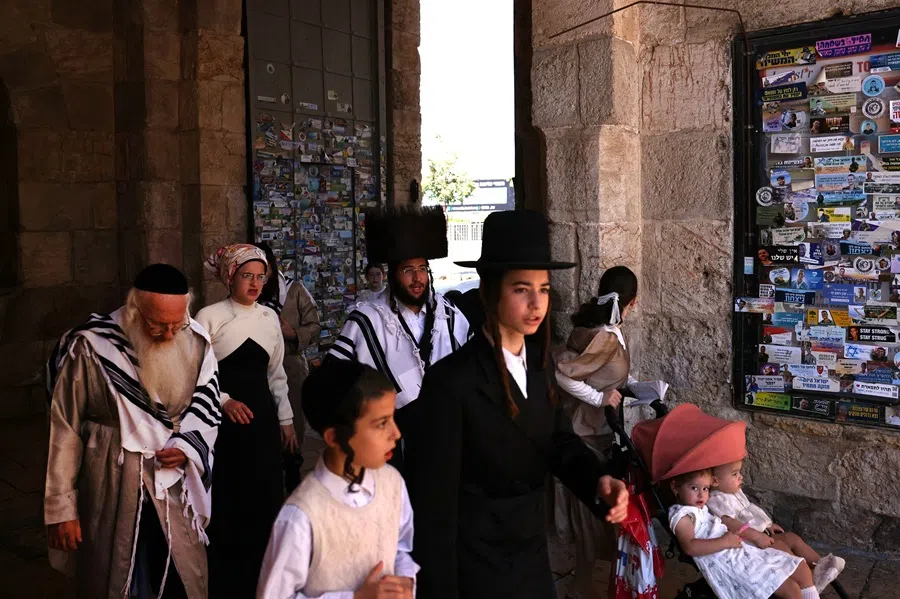 Ultra-Orthodox Jews walk through Jaffa Gate in Jerusalem’s Old City on 30 August 2025. (Hazem Bader/AFP)
