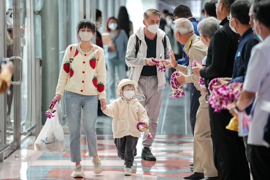 Passengers from China's Xiamen arrive at Bangkok's Suvarnabhumi airport after China reopens its borders amid the Covid-19 pandemic, in Bangkok, Thailand, 9 January 2023. (Athit Perawongmetha/Reuters)