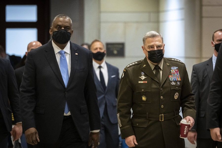 US Defence Secretary Lloyd Austin (left) and chairman of the Joint Chiefs of Staff Army Gen. Mark Milley (right) arrive for a closed door briefing with members of the House of Representatives at the US Capitol Building, 3 February 2022 in Washington, DC. (Drew Angerer/AFP)