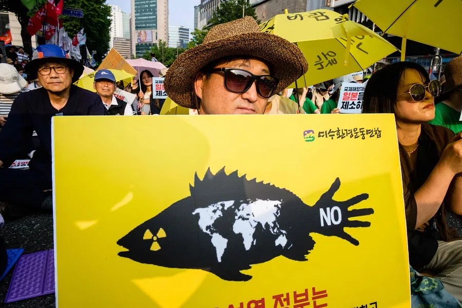Activists gather to protest against a planned release of water from the Fukushima Daiichi nuclear plant in Japan, in Seoul, South Korea, on 24 June 2023. (Anthony Wallace/AFP)