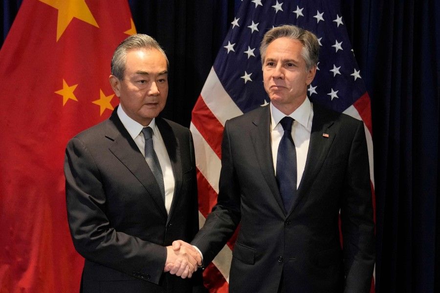 US Secretary of State Antony Blinken (right) shakes hands with Director of the Office of the Foreign Affairs Commission of the Communist Party of China's Central Committee Wang Yi during their bilateral meeting on the sidelines of the Association of Southeast Asian Nations (ASEAN) Foreign Ministers' Meeting in Jakarta on 13 July 2023. (Dita Alangkara/AFP)