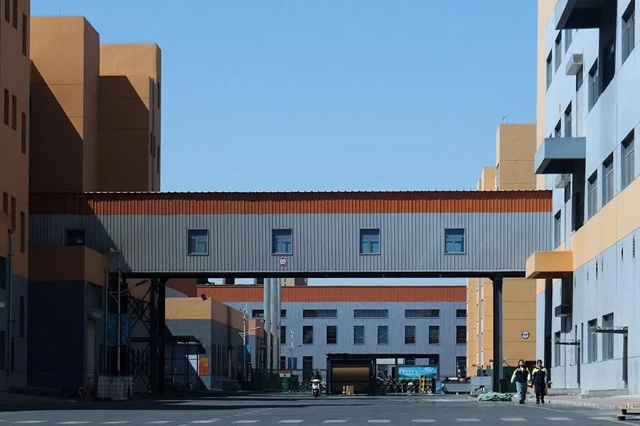 Employees walk at a facility operated by rare earth magnets manufacturer JL Mag, in China’s rare earth industry hub, Baotou, Inner Mongolia, China, 6 April 2026.