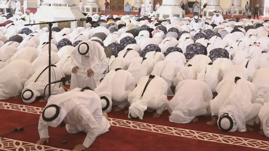 People pray during a funeral held for those killed by an Israeli attack in Doha, including Corporal Badr Saad Mohammed Al-Humaidi Al-Dosari, a member of the Internal Security Force, at the Sheikh Mohammed bin Abdul Wahhab Mosque in Doha, Qatar, 11 September 2025, in this screengrab obtained from a video feed.  (Qatar TV/Reuters TV via Reuters)