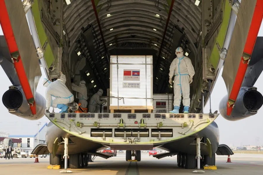 A shipment of 600,000 doses of the coronavirus disease (Covid-19) vaccines donated by China arrives at the Phnom Penh International Airport, in Phnom Penh, Cambodia, 7 February 2021. (Cindy Liu/Reuters)