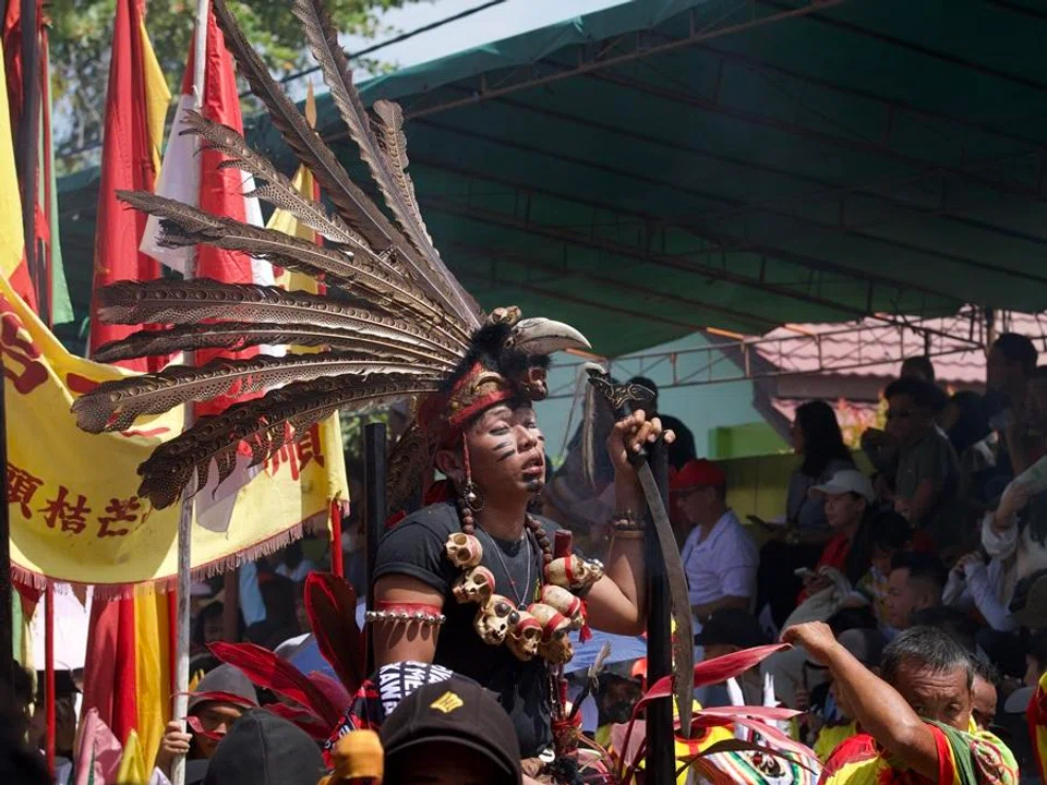A Dayak medium in the Pawai Tatung parade being in a trance.